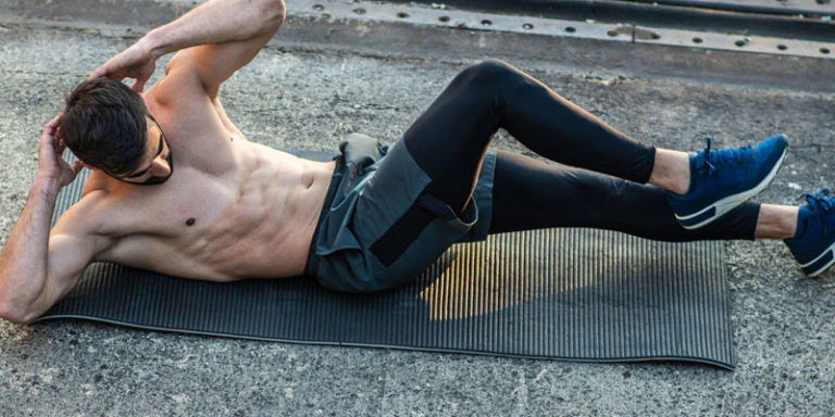 Male performing ab workouts